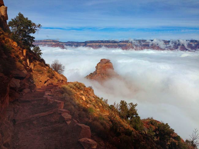 A view from above O'Neill Butte, looking down toward it from the South Kaibab Trail during an inversion event